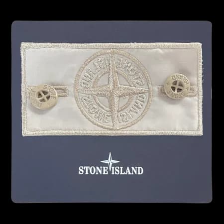 Angled view showing beige badge texture